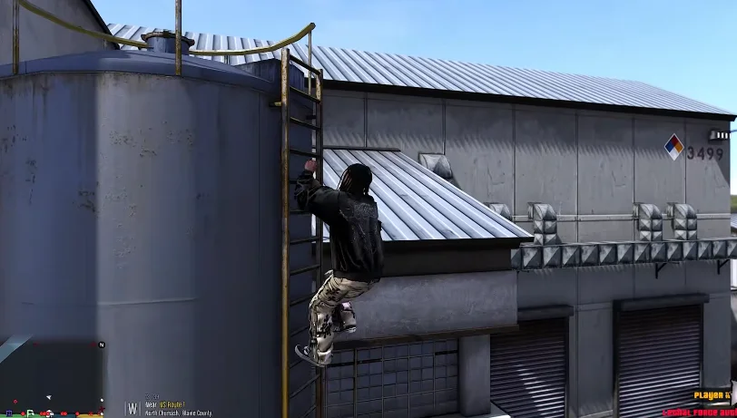In GTA Mzansi Kasi Vibes Download, a person in a black jacket and patterned pants climbs a yellow metal ladder attached to a large industrial storage tank beside a grey warehouse.