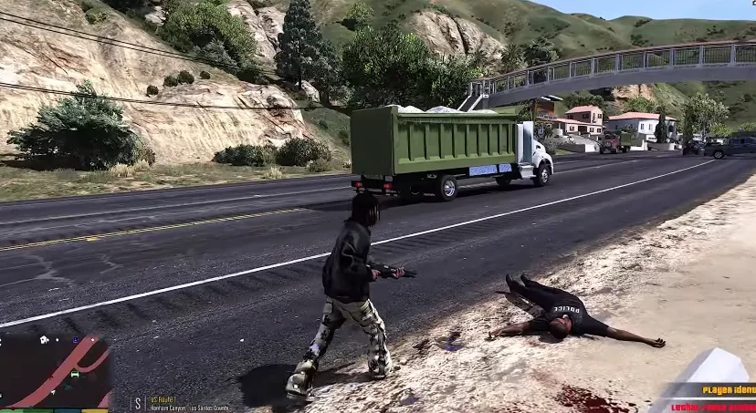 GTA Mzansi APK Offline 1 In a screenshot of GTA Mzansi, a person in black clothing holding a weapon stands near a body on the ground beside a road, with a green truck driving by in the background.