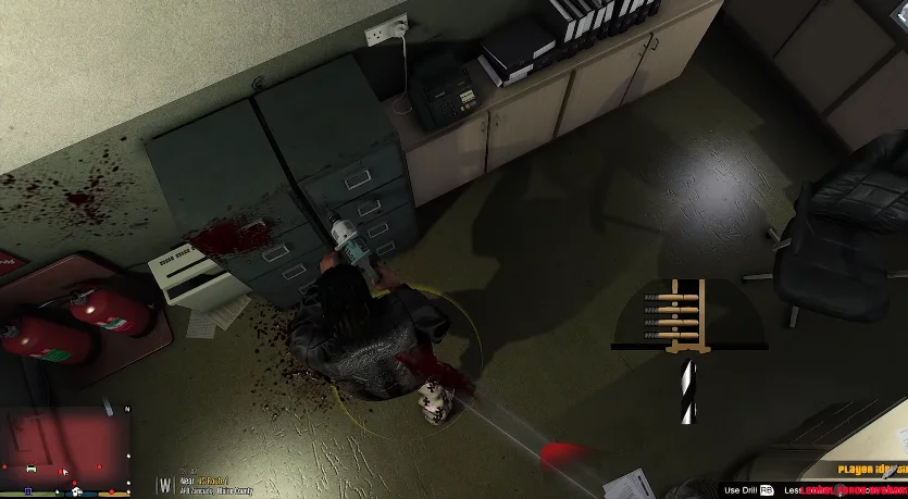 Kasi Vibes 18 Aerial view of a room in a GTA Mod SA in which a person is drilling a filing cabinet, suggesting a violent scene with blood stains on the ground.